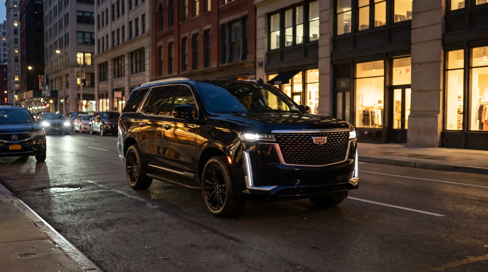 A black Cadillac Escalade on a New York street at dusk.